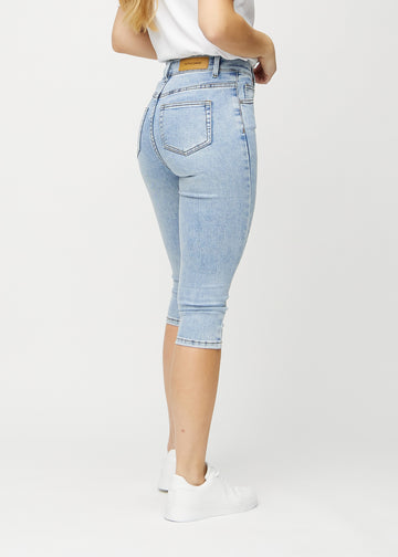 Light denim skinny capris viewed from the back, so the entire product can be seen.