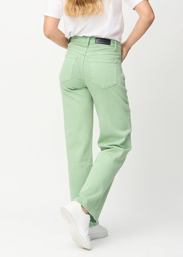 Light green loose jeans seen from the back, so the entire product can be seen.
