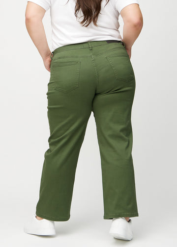 Dark green loose jeans seen from the back on a plus-size model, so the entire product can be seen.