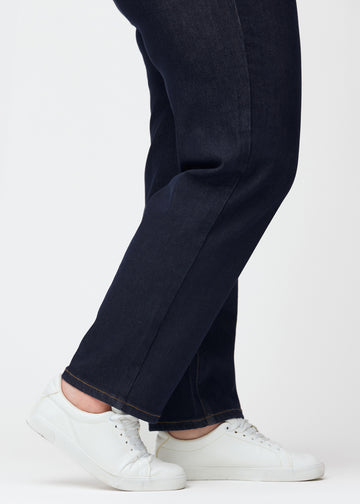 Deep dark blue denim jeans for women in the color Midnights with a regular fit, shown close up at the ankles on a plus-size model to display the straight finish.