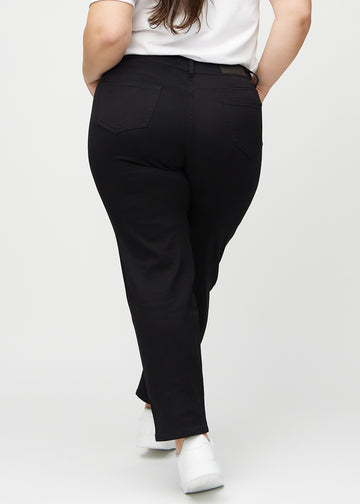 Regular jeans for women in black, color Ravens. Back view on a plus-size model, showing the full fit.