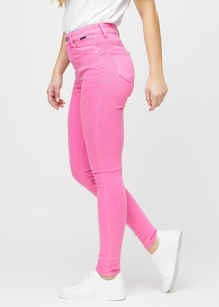 Skinny jeans for women in light pink, color Flamingos. Side view on a model.