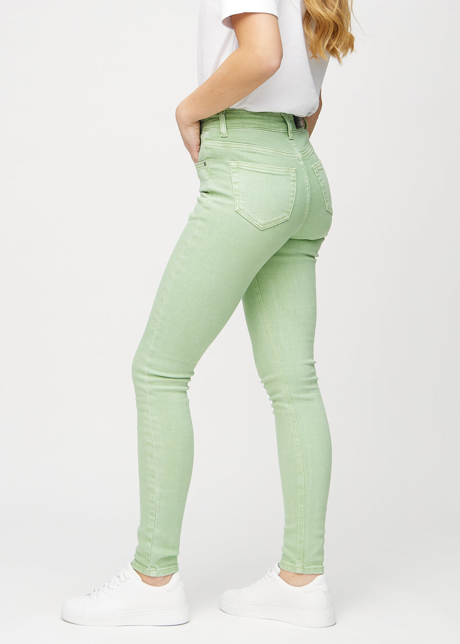 Skinny jeans for women in light green, color Mints. Side view on a model.