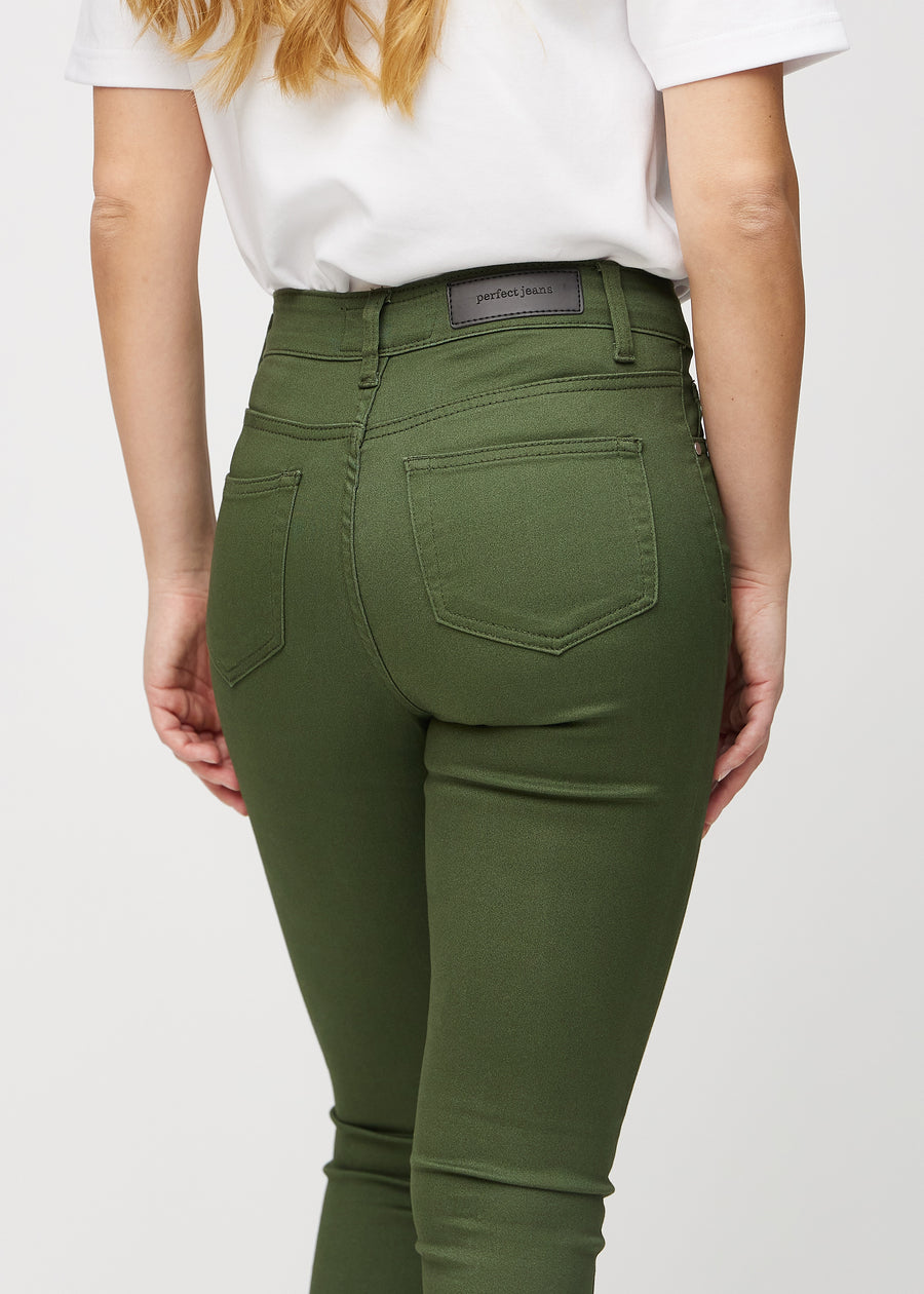 Dark green skinny jeans seen from the back close up to show details.