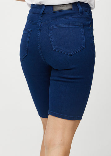 Dark blue skinny middle shorts seen from the back close up to show details.