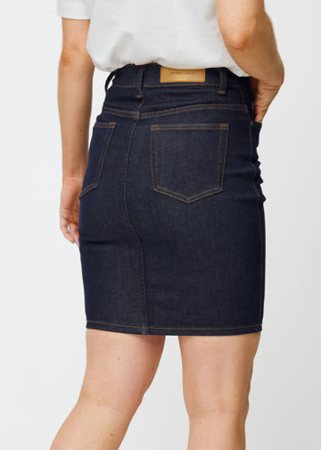 Deep dark blue denim skirt for women in the colour Midnights seen from the back in close-up to show fit and details.