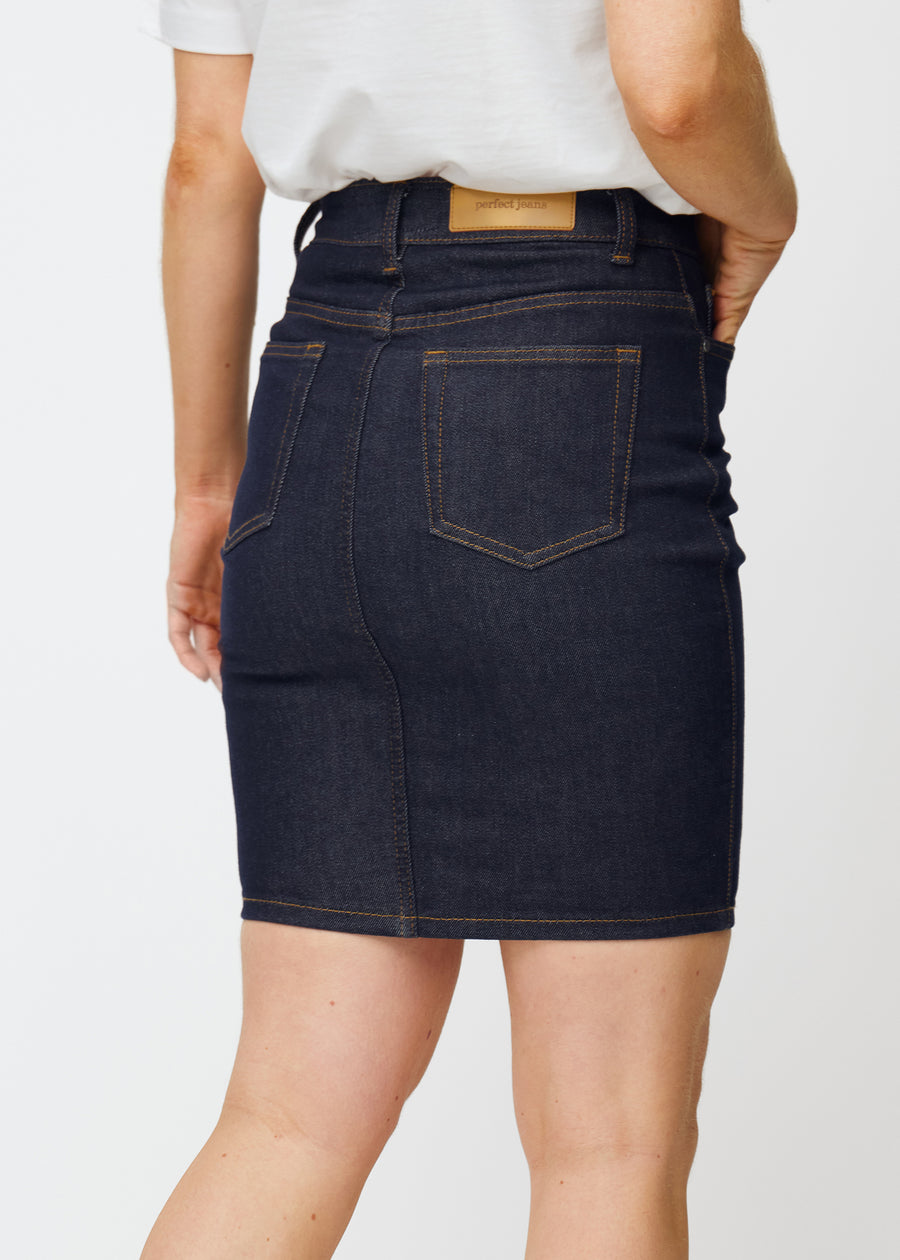 Deep dark blue denim skirt for women in the colour Midnights seen from the back in close-up to show fit and details.