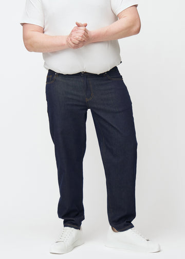 Deep dark blue denim jeans for men in the color Midnights with a regular fit seen from the front on a plus-size model.