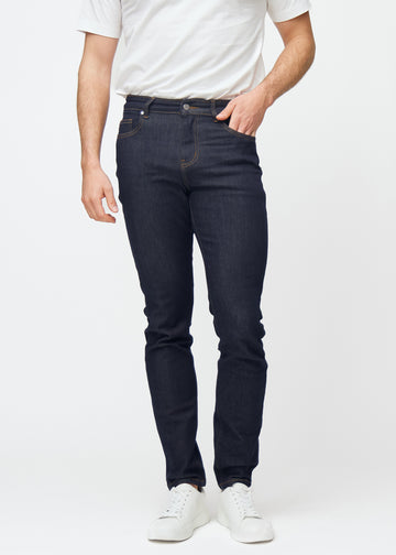 Deep dark blue denim jeans for men in the color Midnights with a slim fit that sits naturally at the hip and follows the legs more closely, front view.