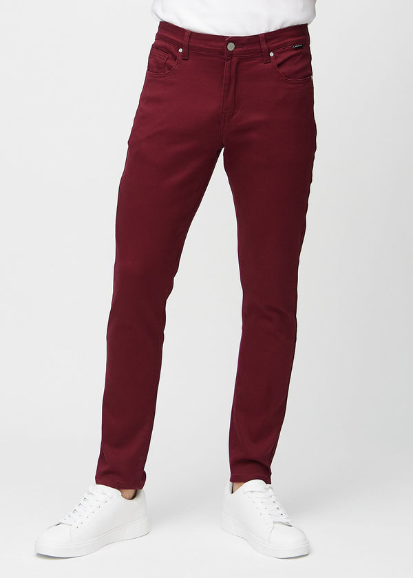 Dark red slim jeans, model name Santas, fitted closely along the legs, front view.
