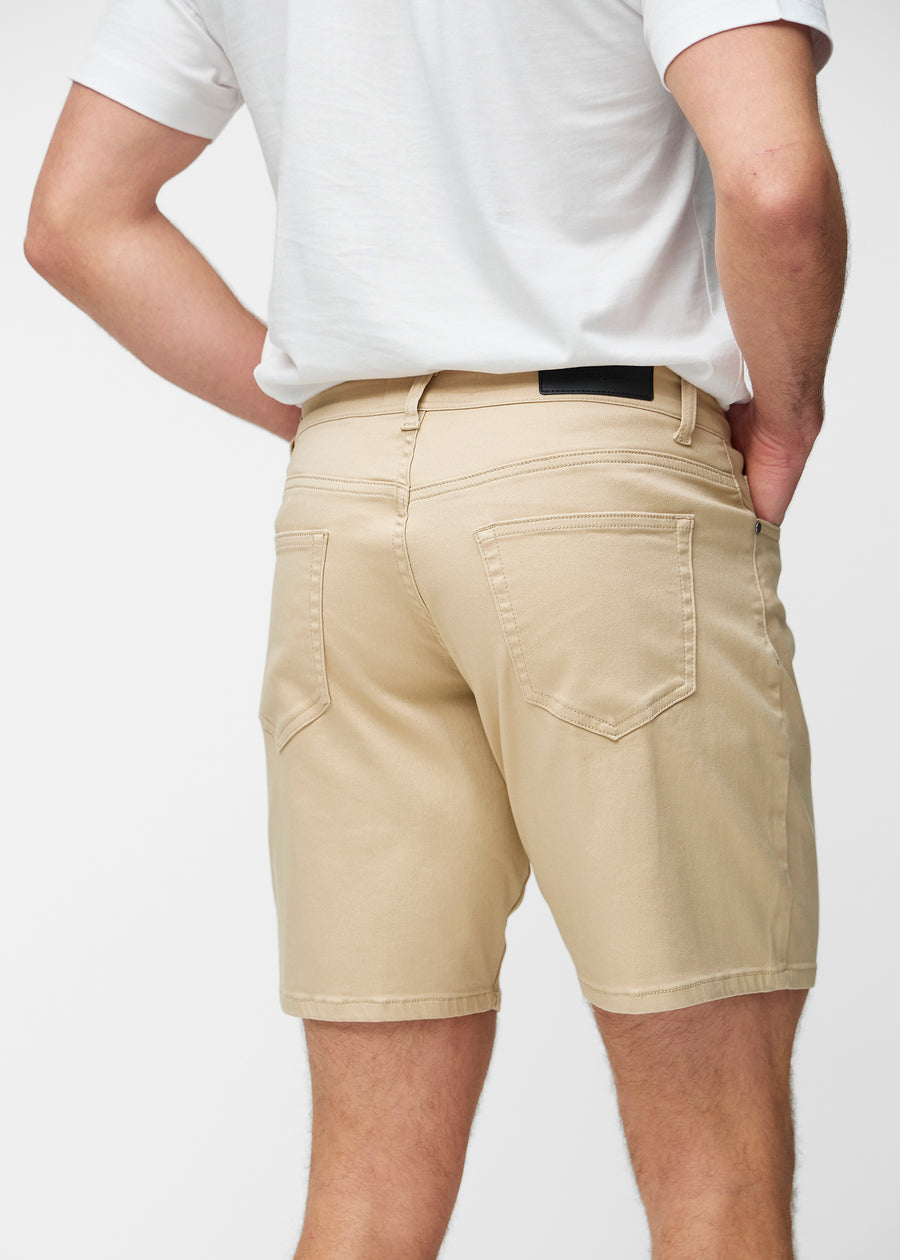 Beige shorts for men in the colour Gazelles seen from the back close up to show fit and details.