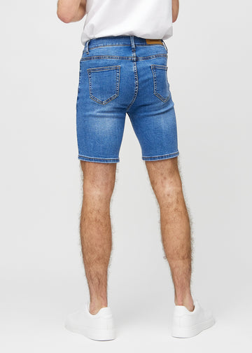 Denim middle-slim shorts seen from the back, so the entire product can be seen.